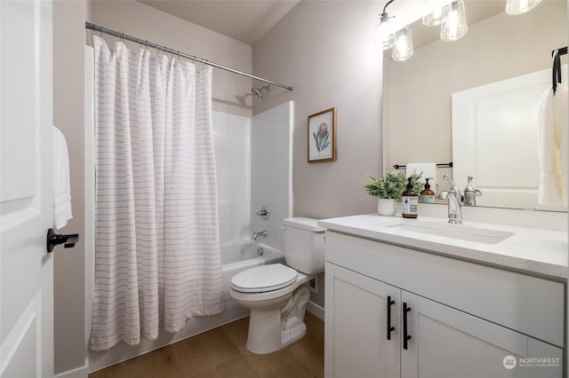 full bathroom featuring shower / bath combination with curtain, vanity, hardwood / wood-style flooring, and toilet