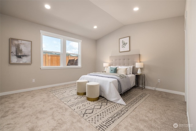 carpeted bedroom featuring vaulted ceiling