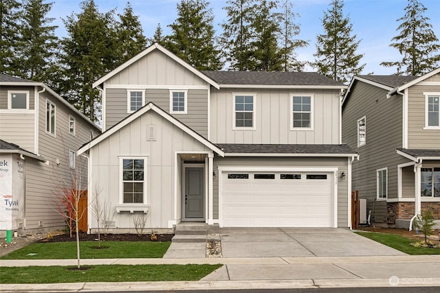 view of front of home featuring a garage and a front yard