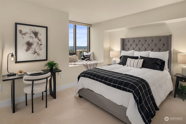 bedroom with light colored carpet