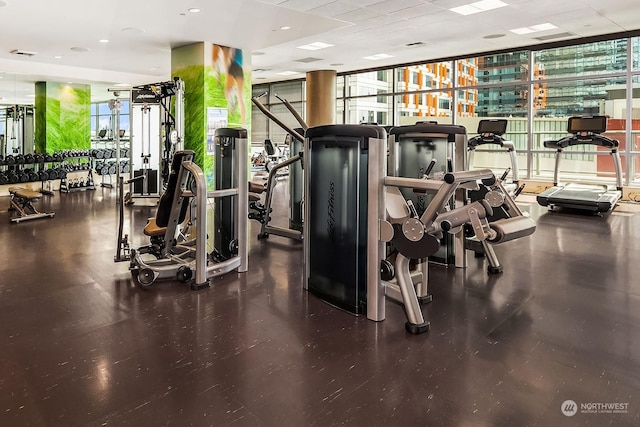 exercise room featuring floor to ceiling windows