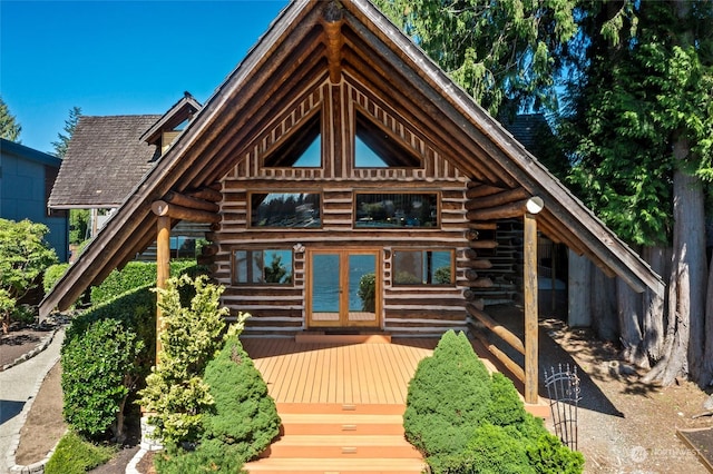 view of front of property with a deck and french doors