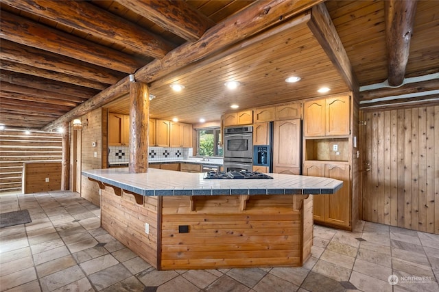 kitchen with paneled fridge, stainless steel double oven, tile counters, and wooden ceiling