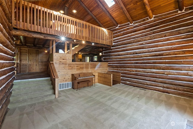 unfurnished living room featuring beam ceiling, rustic walls, wooden ceiling, high vaulted ceiling, and carpet