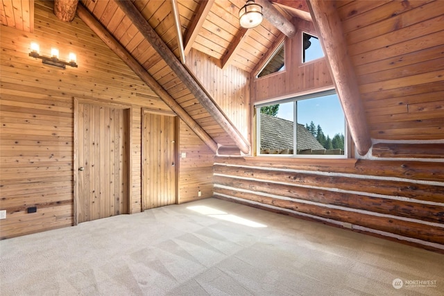 additional living space with wood walls, high vaulted ceiling, rustic walls, beam ceiling, and wood ceiling