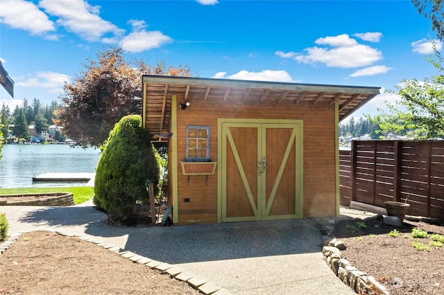 view of outbuilding featuring a water view