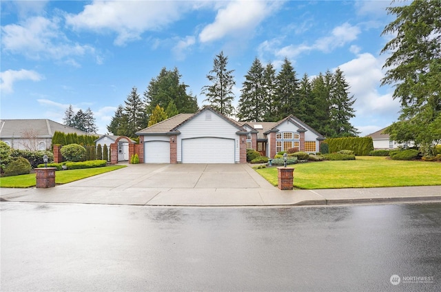 ranch-style home featuring a front lawn and a garage