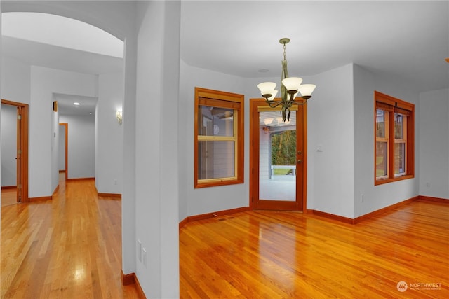 interior space with light hardwood / wood-style flooring and a chandelier