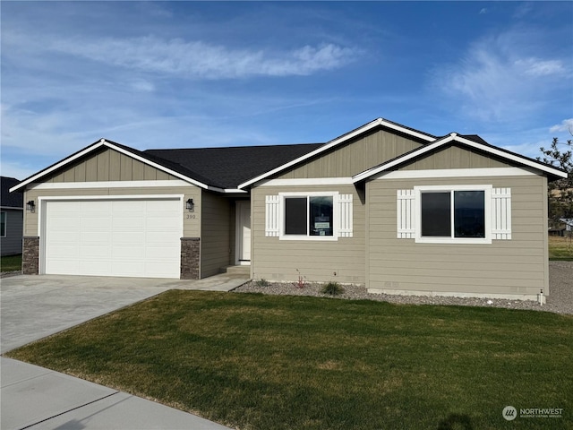 view of front facade with a garage and a front lawn