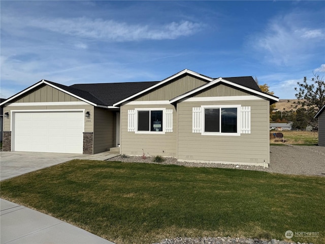 view of front of property with a garage and a front yard