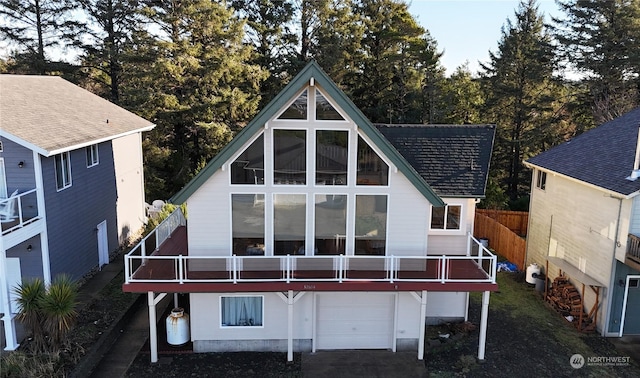 back of property featuring a garage