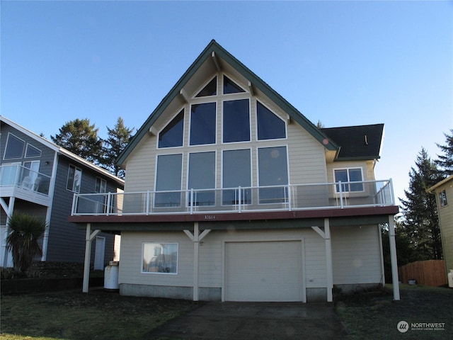 rear view of property with a garage