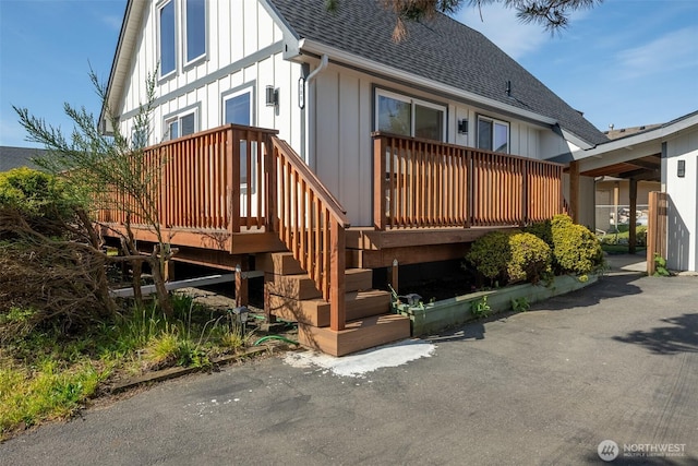 585 Ocean Shores Blvd SW, Ocean Shores, WA 98569 - back of property featuring a shingled roof, board and batten siding, and a wooden deck
