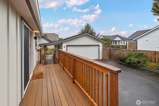 585 Ocean Shores Blvd SW, Ocean Shores, WA 98569 - wooden deck featuring fence, a garage, and a residential view