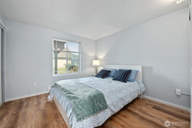 585 Ocean Shores Blvd SW, Ocean Shores, WA 98569 - bedroom with wood finished floors and baseboards