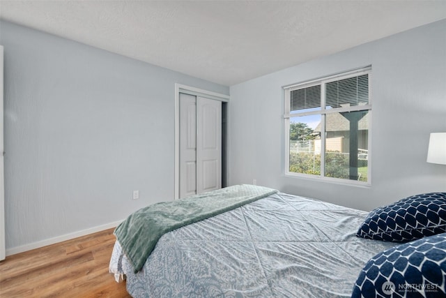 585 Ocean Shores Blvd SW, Ocean Shores, WA 98569 - bedroom with wood finished floors, baseboards, and a closet