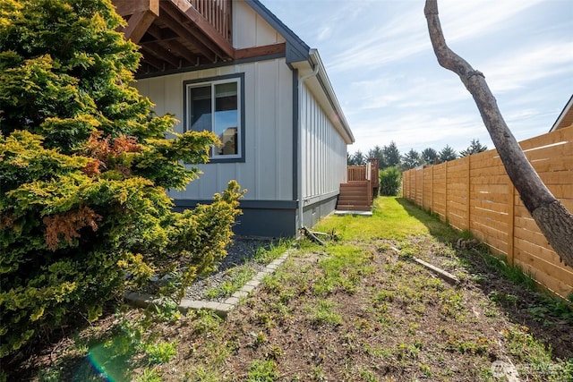 585 Ocean Shores Blvd SW, Ocean Shores, WA 98569 - view of side of home with fence and board and batten siding
