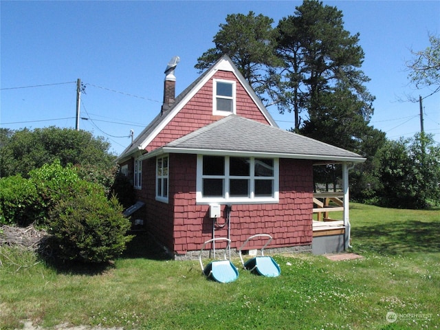 view of home's exterior with a yard