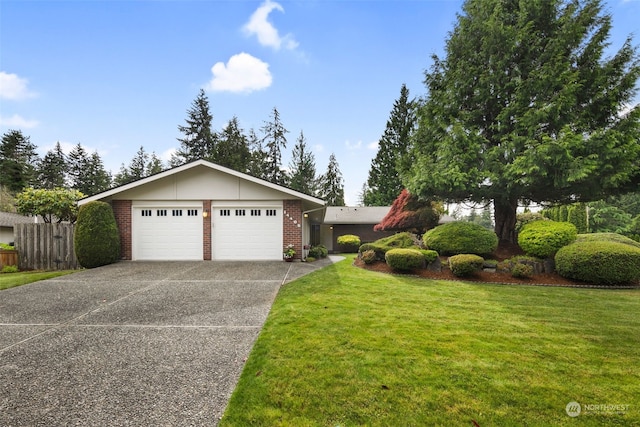 view of front of house featuring a front yard and a garage