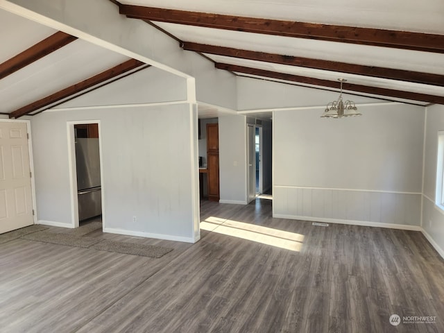 unfurnished room with lofted ceiling with beams and dark hardwood / wood-style floors