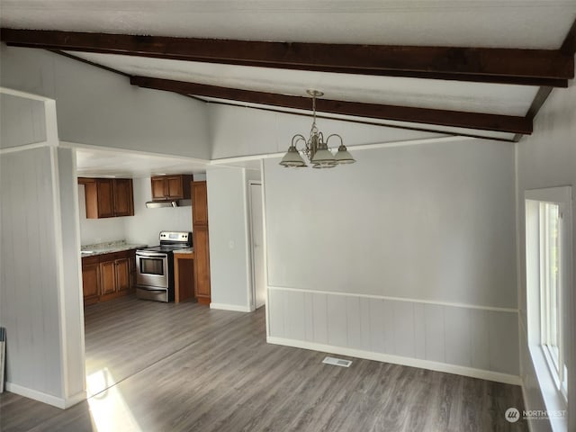 kitchen with vaulted ceiling with beams, electric range, pendant lighting, and a notable chandelier