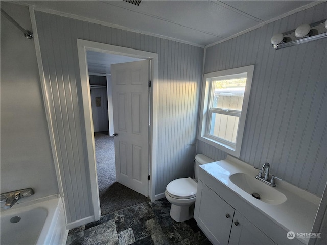 bathroom featuring a tub to relax in, vanity, crown molding, toilet, and wood walls