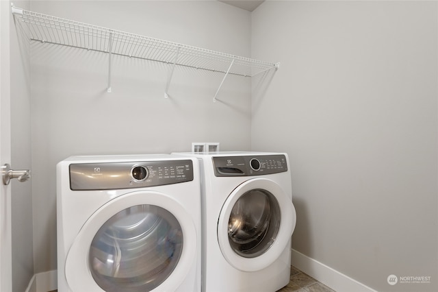 laundry room with washing machine and dryer