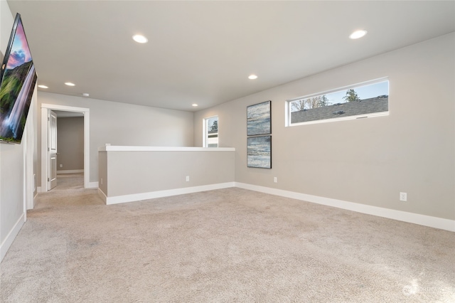 empty room featuring light carpet