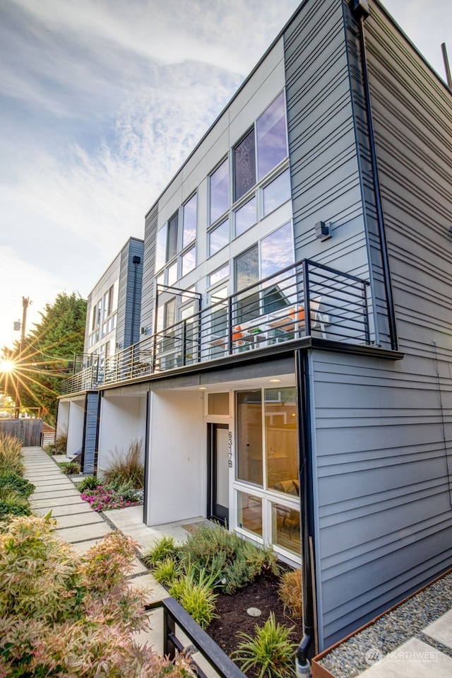 rear view of property with a balcony