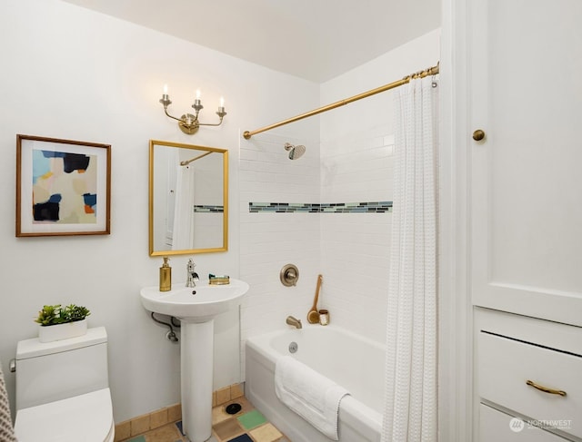 full bathroom with shower / bath combination with curtain, toilet, and sink