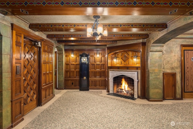 interior space featuring beamed ceiling and carpet floors