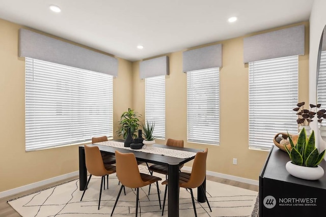 dining space with light hardwood / wood-style floors