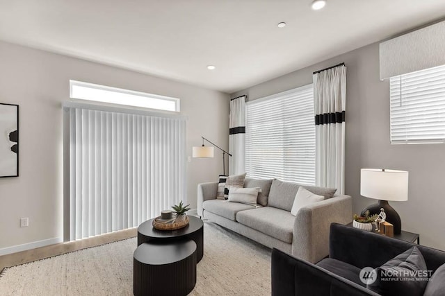 living room with a healthy amount of sunlight and hardwood / wood-style flooring