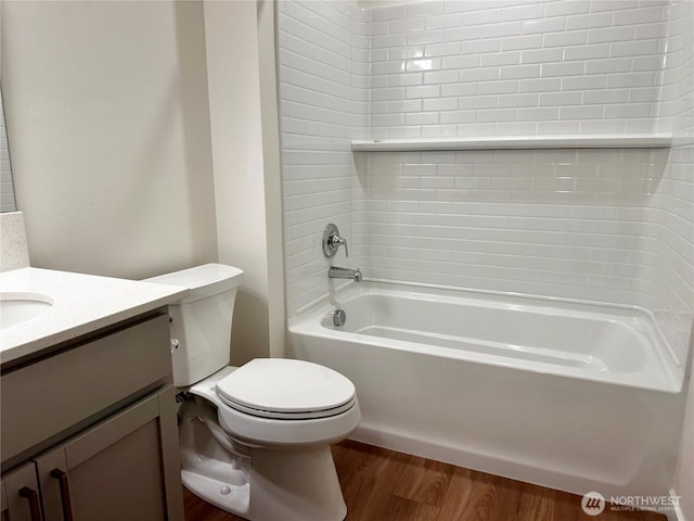 13628 187th St E Unit 36, Puyallup, WA 98374 - full bath featuring vanity, toilet, wood finished floors, and shower / washtub combination