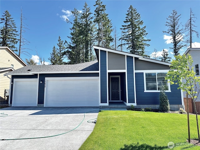 13628 187th St E Unit 36, Puyallup, WA 98374 - mid-century home with an attached garage, driveway, and a front yard