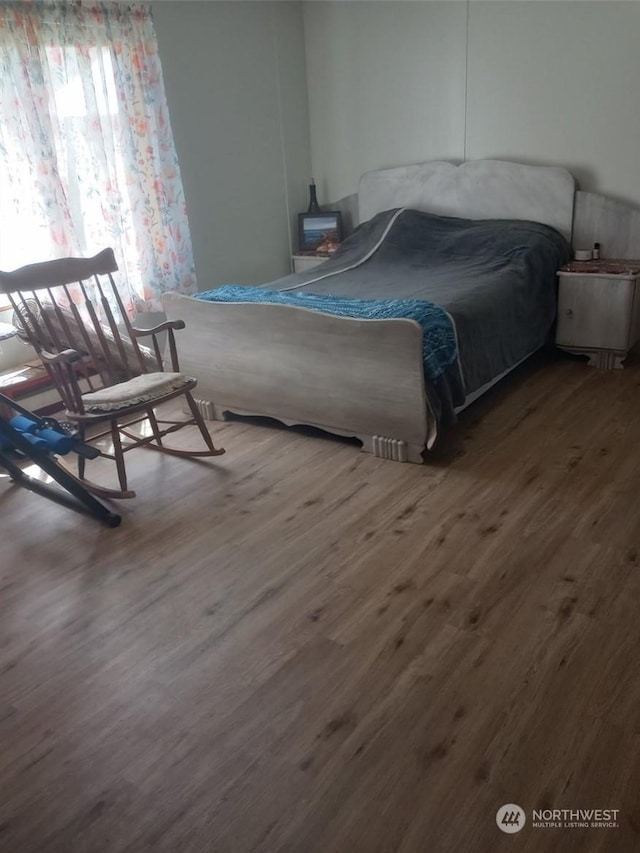 bedroom featuring hardwood / wood-style flooring