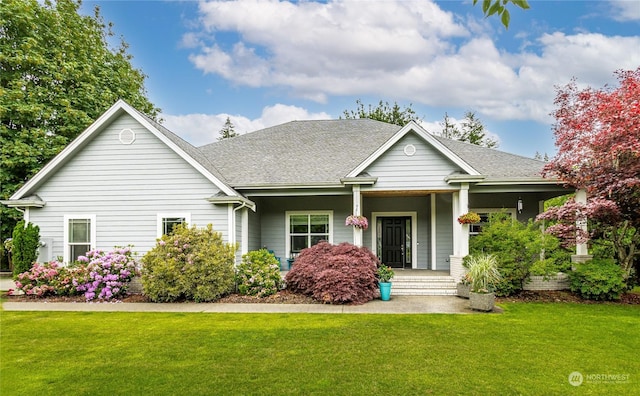 view of front of home featuring a porch and a front lawn