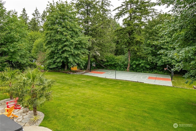 view of basketball court featuring a lawn