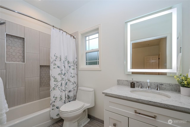 full bathroom featuring toilet, shower / tub combo, and vanity