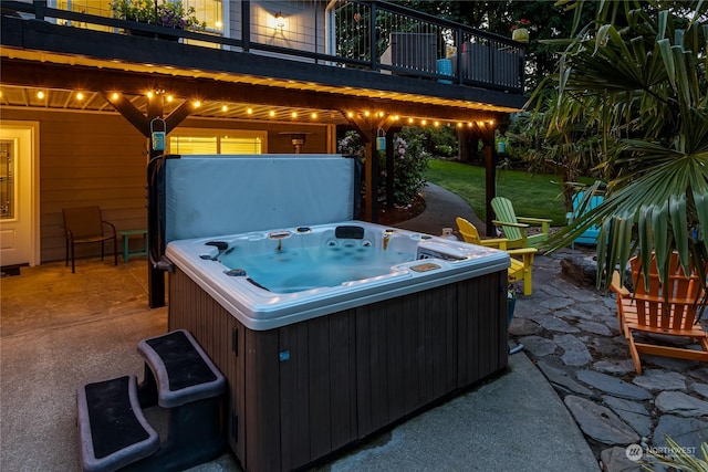 view of patio / terrace featuring a balcony and a hot tub