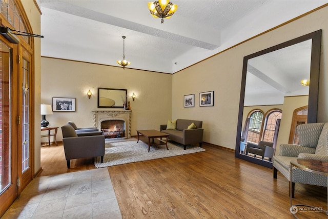 living room with a textured ceiling and light wood-type flooring