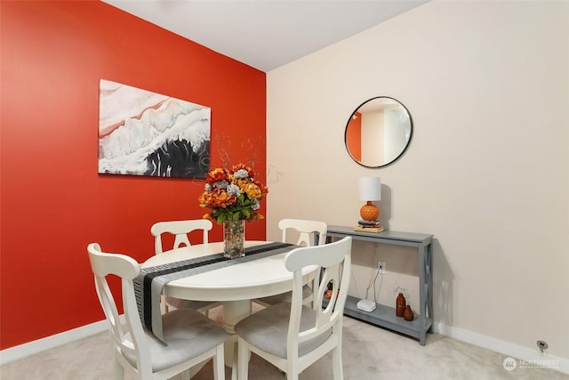 view of carpeted dining area