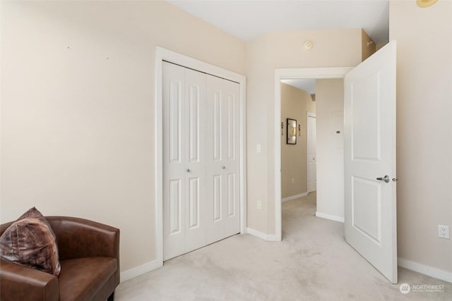 sitting room with light colored carpet