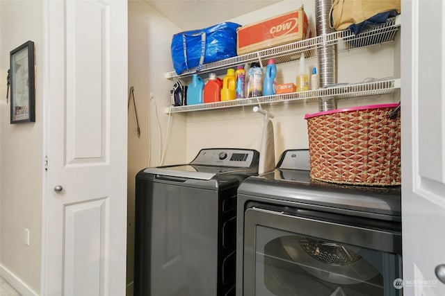 washroom with independent washer and dryer