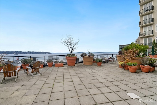 view of patio / terrace with a water view