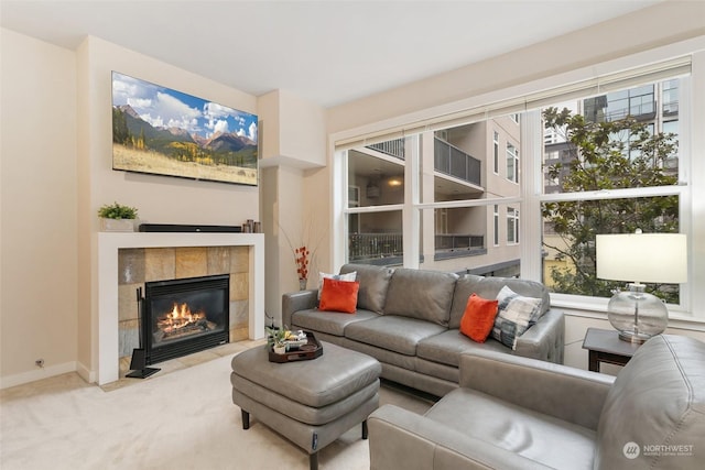 living room with light carpet and a tile fireplace