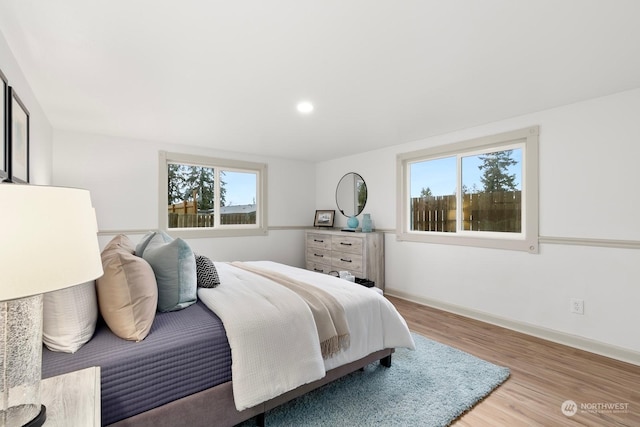 bedroom with light hardwood / wood-style floors