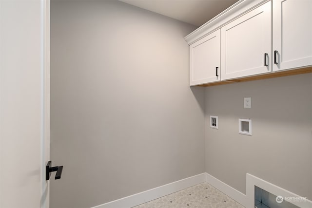 laundry room featuring cabinets and washer hookup