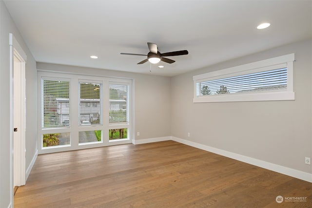 unfurnished room featuring light hardwood / wood-style floors and ceiling fan