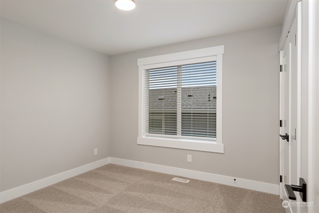 view of carpeted spare room